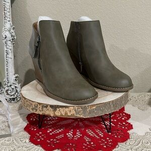 Brand new olive green booties. Zip on both sides. Size 9. Heel 3.25”
